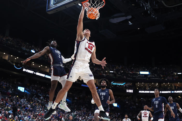 Vladislav Goldin of the Florida Atlantic Owls dunks in front of Demetre Roberts of the Fairleigh Dickinson Knights on Sunday in Columbus, Ohio. FAU dispatched the Cinderella Knights from the 2023 NCAA tournament.