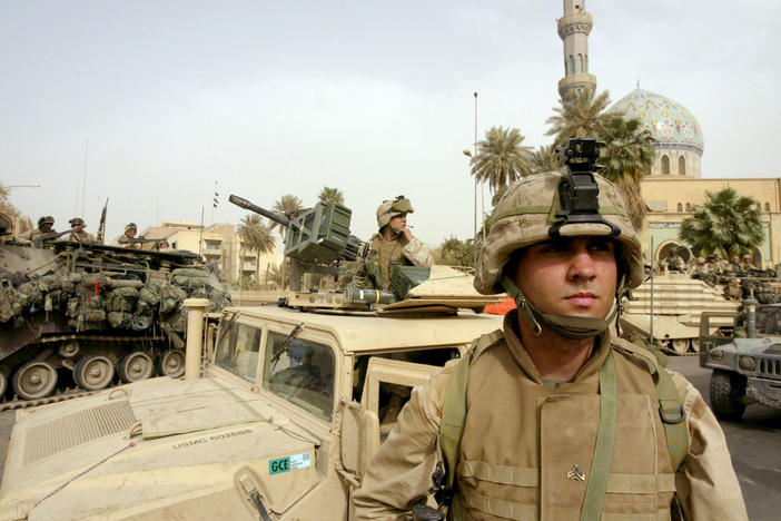 U.S. Marines take up positions in the area around the Palestine hotel in the center of Baghdad, April 9, 2003.