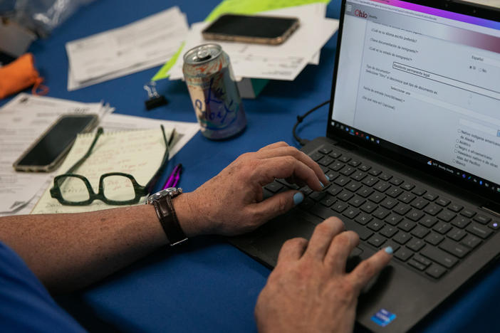 Samuel Camacho, a health insurance navigator with the Universal Health Care Action Network of Ohio, assists people in enrolling for or renewing Medicaid.