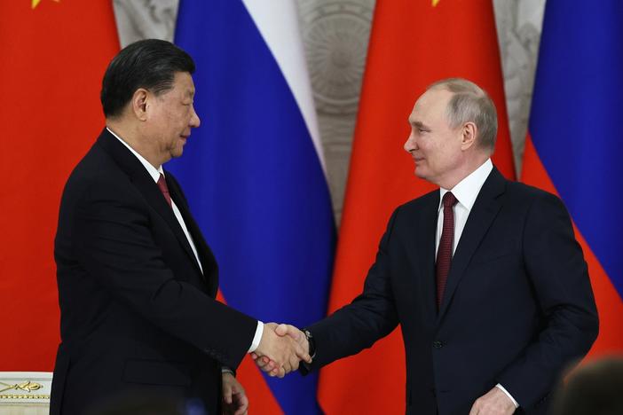 Russian President Vladimir Putin, right, and Chinese President Xi Jinping shake hands after speaking to the media during a signing ceremony following their talks in Moscow on Tuesday.