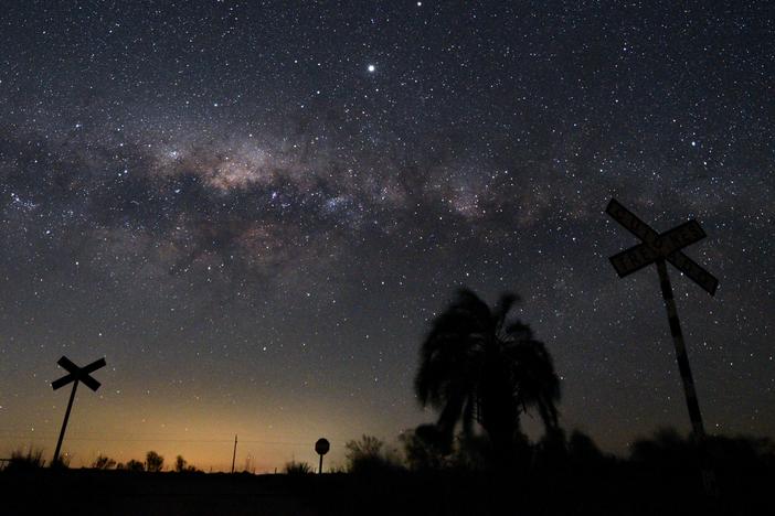 The Milky Way's Galactic Center and Jupiter (brightest spot at center top) are seen from near Reboledo, department of Florida, Uruguay, early on August 24, 2020.