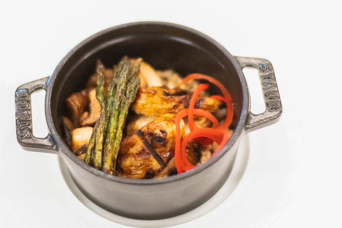 GOOD Meat cultivated chicken fillet cooked in a pot, with asparagus and mushrooms. The dish was created without killing a bird.