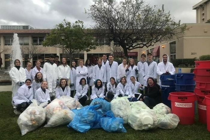Professor Stephanie Hughes and students categorizing various types of waste in January 2020.