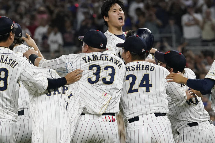 Japan pitcher Shohei Ohtani, center, celebrates after defeating the United States at the World Baseball Classic final game, Tuesday, March 21, 2023, in Miami.