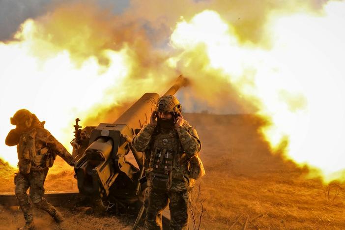 Ukrainian servicemen fire with a D-30 howitzer at Russian positions near Bakhmut, eastern Ukraine, on Tuesday.