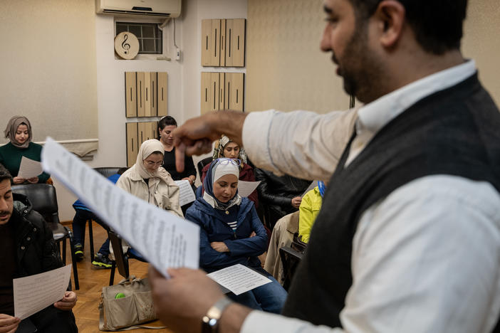 Ibrahim Muslimani, 30, speaks to a class about a piece of music blending different eras and languages at the Nefes Foundation for Arts and Culture, which he founded in 2016, in Gaziantep, Turkey, on Nov. 22, 2022.