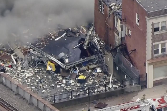 In this screen grab from video provided by WPVI-TV/6ABC, smoke rises from an explosion at the R.M. Palmer Co. plant in West Reading, Pa., on Friday.