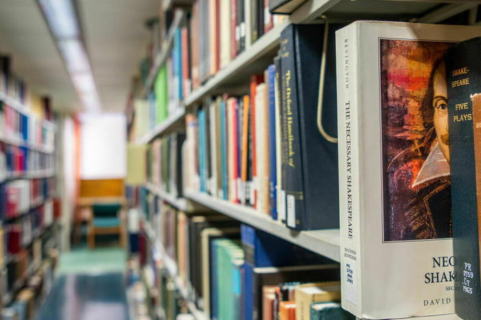 Books line the shelves at the Rice University Library in April 2022 in Houston.