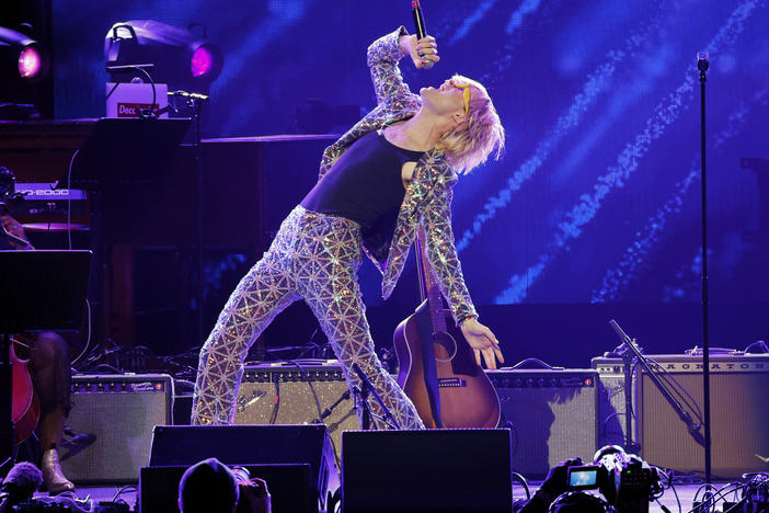 "Hate on me," Jake Wesley Rogers sang on stage at the Love Rising benefit concert in Nashville's Bridgestone Arena on March 20. "You might as well hate the sun."