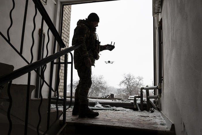 A Ukrainian soldier launches a DJI Mavic 3 drone in Bakhmut, Ukraine, near the frontline with Russian troops on Feb. 18. Ukrainian forces have been using drones for reconnaissance and directing artillery fire. But the Ukrainians have also modified them to conduct attacks on Russian ground forces.