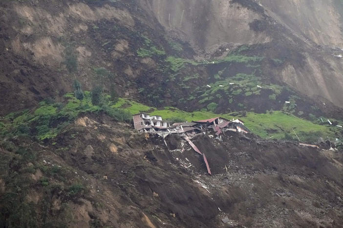 Homes are destroyed after a deadly landslide that buried dozens of homes in Alausi, Ecuador, pictured on Monday.