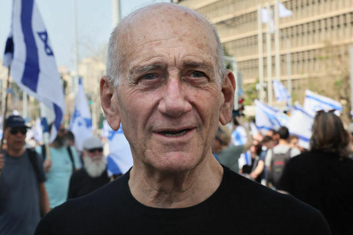 Former Israeli prime minister Ehud Olmert attends a demonstration against the Israeli government's controversial judicial overhaul bill in Tel Aviv on March 1.