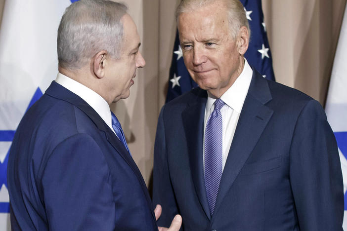 Israeli Prime Minister Benjamin Netanyahu (left) and then-Vice President Biden talk prior to a meeting on the sidelines of the World Economic Forum in Davos, Switzerland, Jan. 21, 2016. President Biden spoke Sunday, with Netanyahu to "express concern" over his government's planned judicial overhaul that has sparked widespread protests across Israel and to encourage compromise.