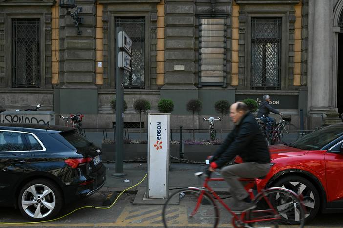 Electric cars charge at a hub in downtown Milan on March 23. Starting in 2035, all cars sold in the European Union will be zero-emission vehicles.