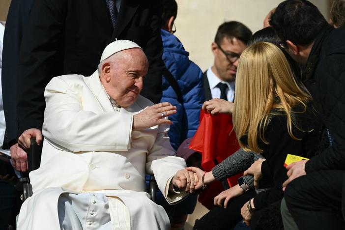 Pope Francis blesses a guest on March 29, 2023 during the weekly general audience at St. Peter's square in The Vatican.
