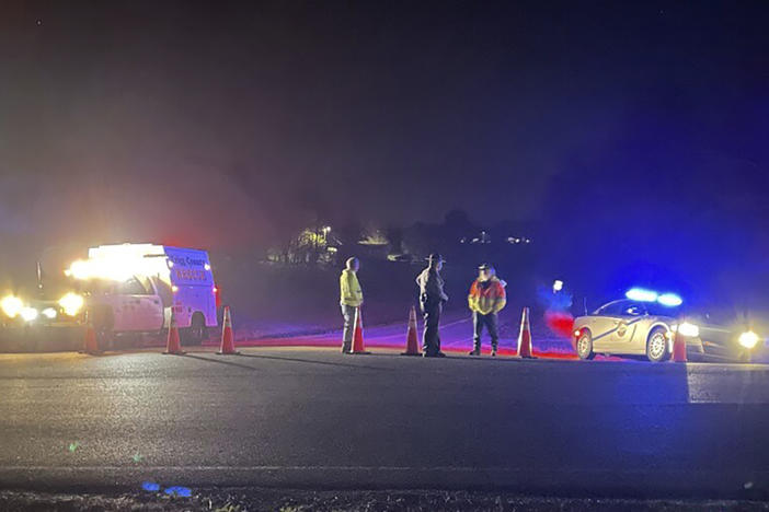 Emergency responders are seen near a site where two military helicopters crashed Wednesday night during a routine training mission in Trigg County, in southwestern Kentucky, on March 30, 2023.