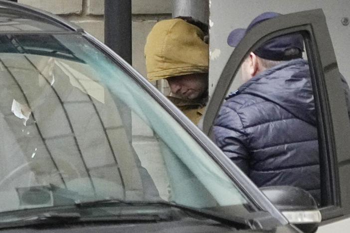 <em>Wall Street Journal</em> reporter Evan Gershkovich is escorted by Russian officers from the Lefortovsky court to a bus, in Moscow, Thursday. Russia's Federal Security Service said its agents detained Gershkovich in the Ural Mountains city of Yekaterinburg, accusing him of trying to obtain classified information.