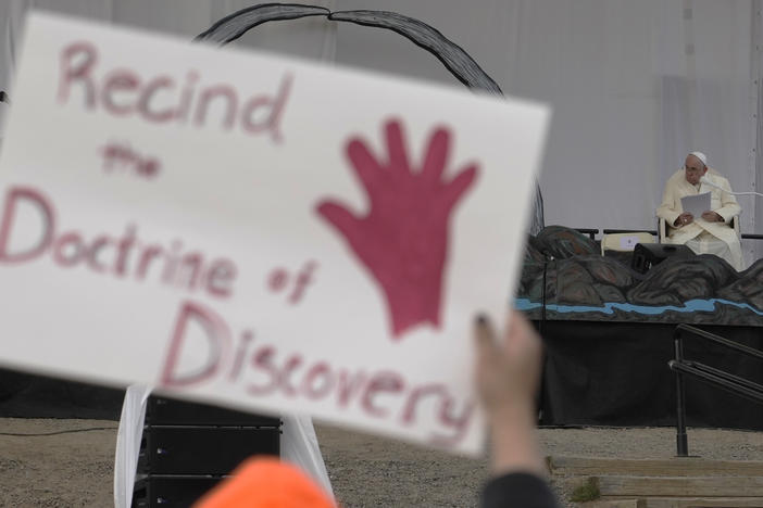 People protest as Pope Francis meets young people and elders at Nakasuk Elementary School Square in Iqaluit, Canada, last July. The Vatican on Thursday formally repudiated the "Doctrine of Discovery." The theory is backed by 15th century papal decrees that legitimized the colonial-era seizure of Native lands and form the basis of some property laws today.