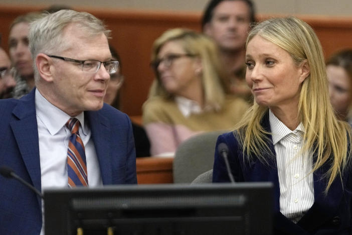 Gwyneth Paltrow and her attorney Steve Owens smile after the reading of the verdict in her lawsuit trial on Thursday in Park City, Utah.