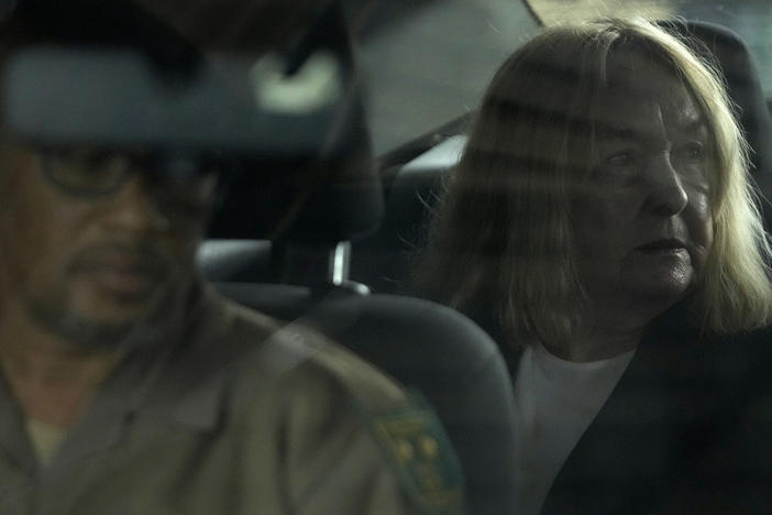 June Steenkamp, the mother of Reeva Steenkamp sits inside the correctional service car Thursday at the Atteridgeville Prison for the parole hearing of Oscar Pistorius in Pretoria, South Africa.