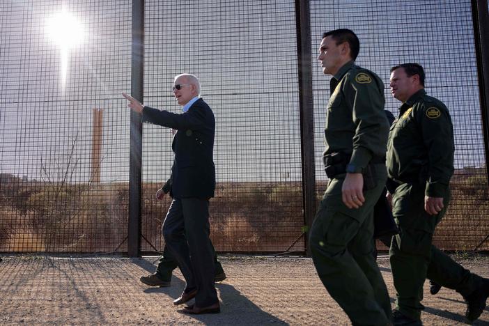 President Biden walks along the US-Mexico border fence in El Paso, Texas, on January 8, 2023.