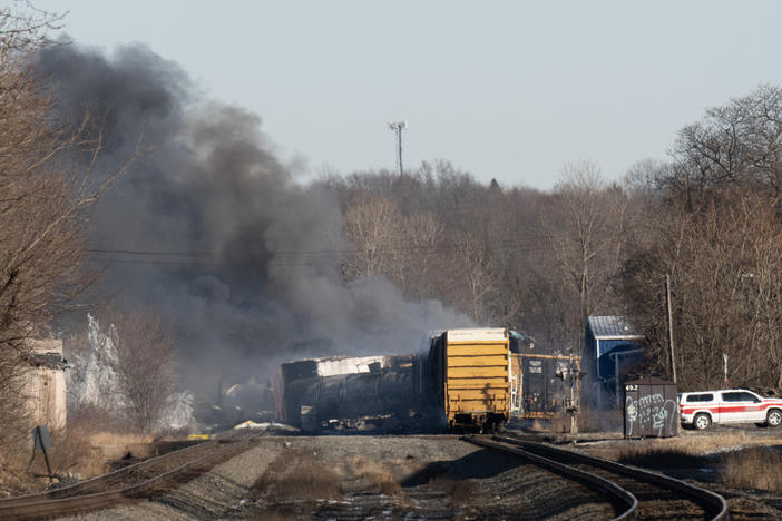 Smoke rises from a derailed cargo train in East Palestine, Ohio, on February 4, 2023.