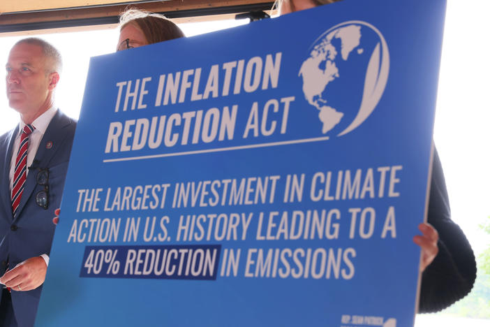A sign touting the Inflation Reduction Act is seen at Glynwood Boat House in Cold Spring, N.Y., on Aug. 17, 2022.