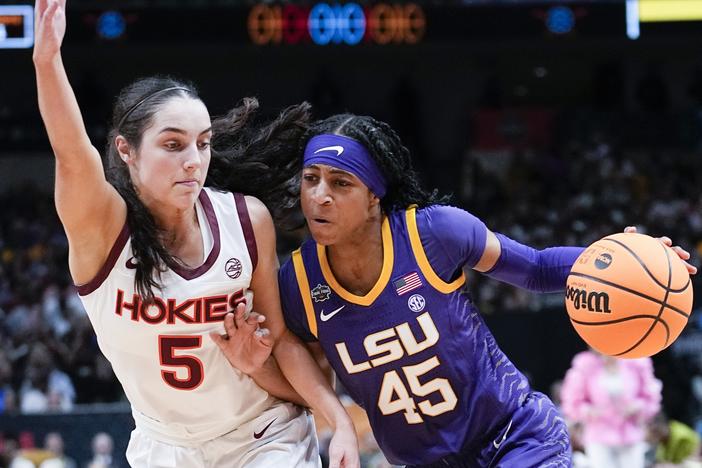 LSU's Alexis Morris drives past Virginia Tech's Georgia Amoore during the first half of an NCAA Women's Final Four semifinals basketball game Friday in Dallas.
