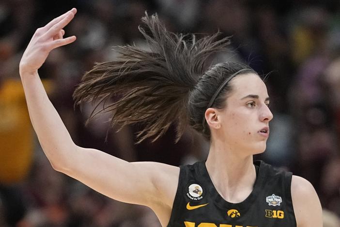 Iowa's Caitlin Clark reacts after a 3-pointer during the second half of an NCAA Women's Final Four semifinals basketball game against South Carolina on Friday in Dallas.