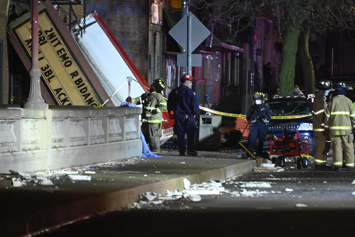 Authorities work the scene at the Apollo Theatre in Belvidere, Ill., after a severe storm hit during a heavy metal concert, killing one person and injuring 28.