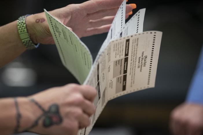 Poll workers sort out early and absentee ballots at a municipal building in Kenosha, Wis., on Election Day, Nov. 3, 2020. The April 4 election will determine majority control of the state Supreme Court.