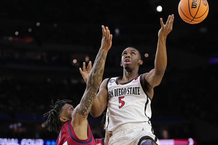San Diego State guard Lamont Butler shoots over Florida Atlantic guard Alijah Martin during the second half of a Final Four college basketball game in the NCAA Tournament on Saturday, April 1, 2023, in Houston.