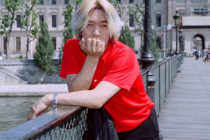 Ryuichi Sakamoto posing for a portrait in Paris in 1996.