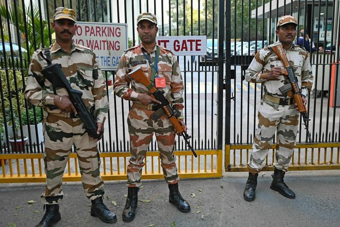 Border Police stand guard outside the office building where Indian tax authorities raided the BBC's office in New Delhi on Feb. 15.