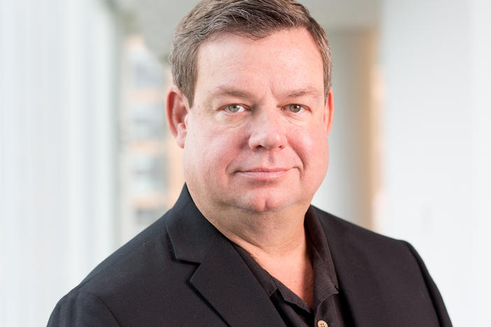 Wade Goodwyn reported for NPR for three decades and was known for his deep Texas bass and keen reporting observations and sharp writing. He's pictured here at NPR headquarters in Washington, D.C., in 2018.