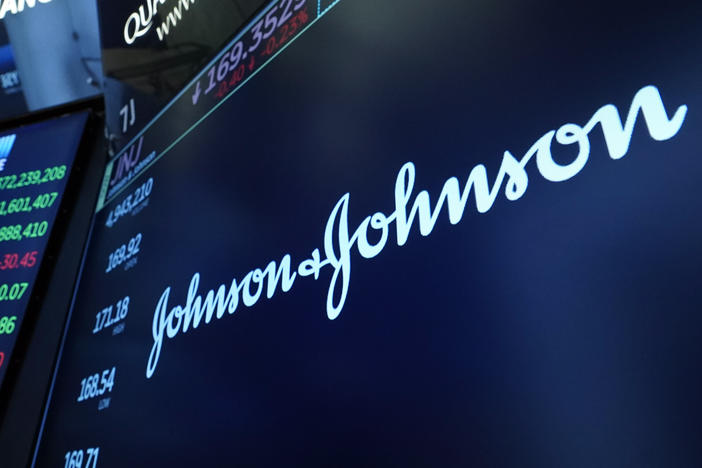 The Johnson & Johnson logo appears above a trading post on the floor of the New York Stock Exchange on July 12, 2021.