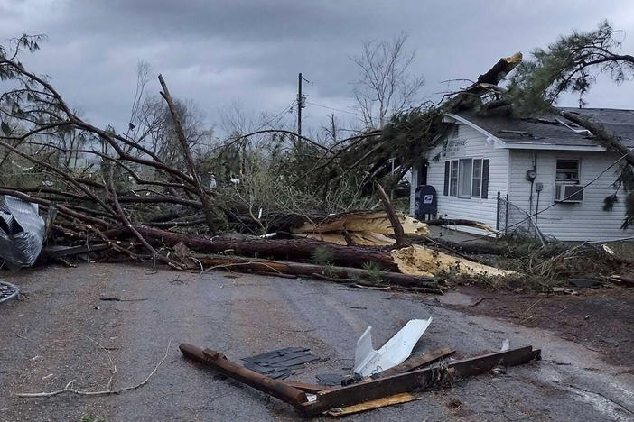 Debris covers the ground as homes are damaged after severe weather in Glen Allen, Mo., on Wednesday.