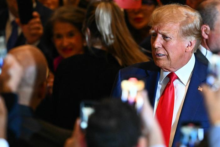 Former President Donald Trump arrives to speak at his Mar-a-Lago estate in Palm Beach, Fla., on Tuesday night, following his arraignment in New York on felony charges.