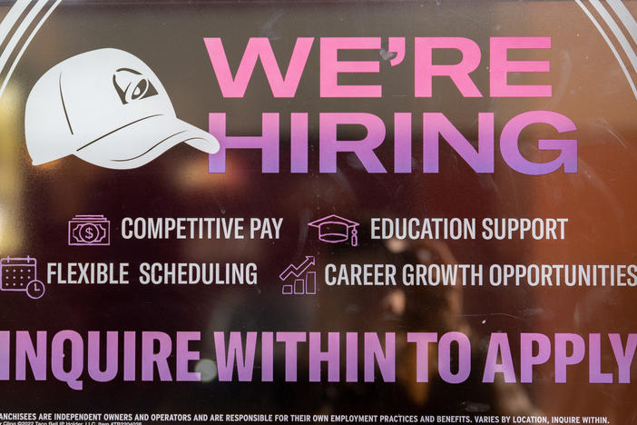 A call for employment sign is displayed at a Taco Bell in Austin, Texas, on March 10, 2023. The labor market is slowing as higher interest rates start to filter through the economy.