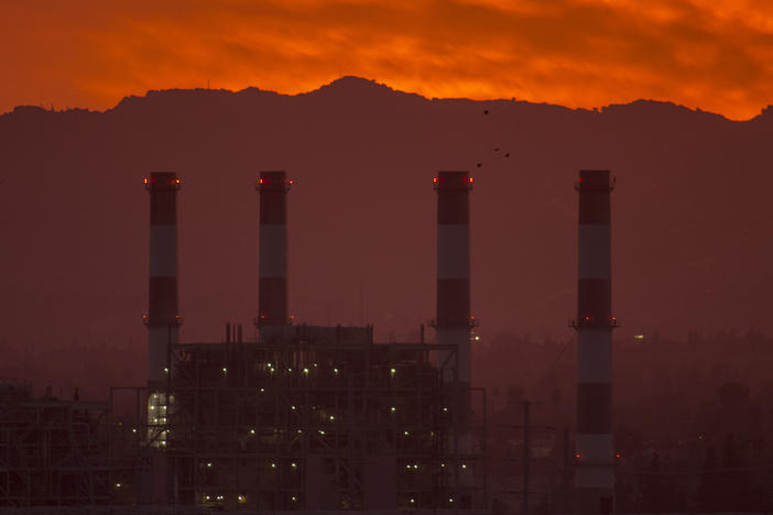 To avoid some of the worst impacts of climate change, greenhouse gas emissions need to be eliminated or offset by midcentury, according to the United Nations. To get there, activist investors say banks and insurance companies need to account for the emissions they contribute to by underwriting and investing in fossil fuel infrastructure like this natural gas plant in California.