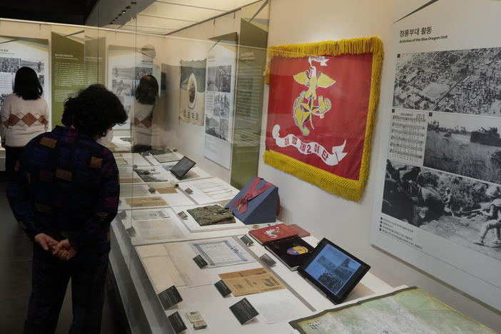 Visitors look at an exhibition of South Korean soldiers' records from the Vietnam War at the War Memorial of Korea in Seoul, Feb. 17.