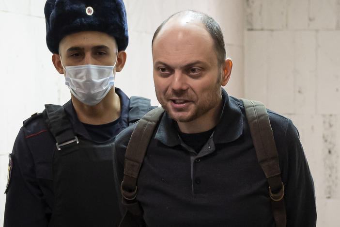 Russian opposition activist Vladimir Kara-Murza is escorted to a hearing in a court in Moscow, Feb. 8. He has been imprisoned in Moscow since April 2022 for speaking out against Russia's invasion of Ukraine.