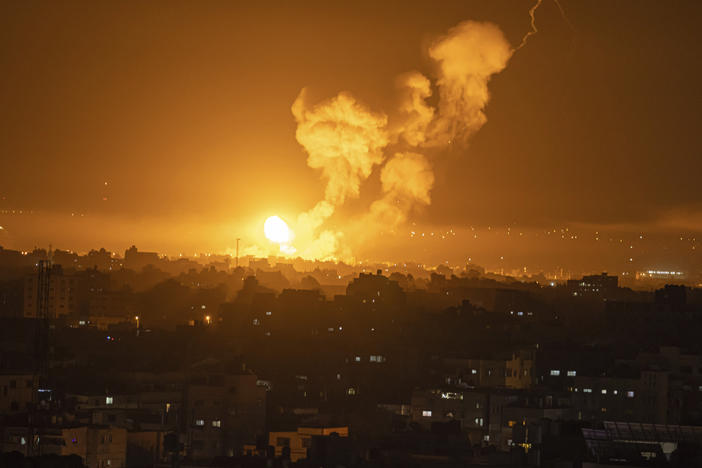 Fire and smoke rise following an Israeli airstrike in central Gaza Strip, Friday, April 7, 2023.