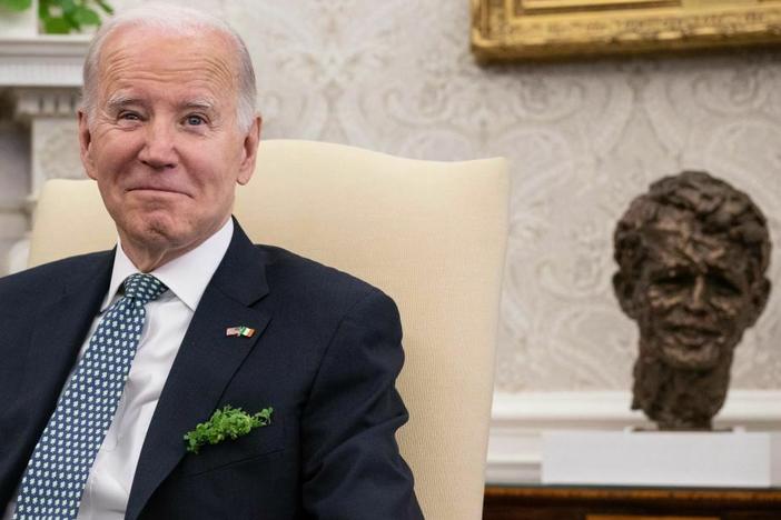 President Biden is pictured in the Oval Office on St. Patrick's Day. Biden, who is Irish Catholic, is traveling to Ireland on Tuesday.