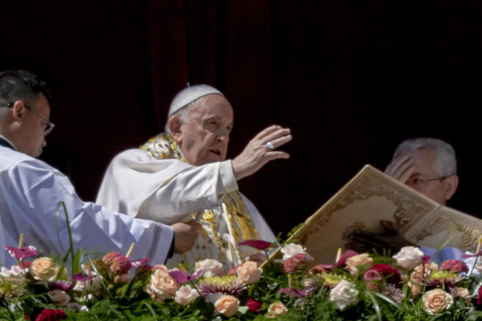 Pope Francis bestows the plenary 'Urbi et Orbi' (to the city and to the world) blessing from the central lodge of the St. Peter's Basilica at The Vatican at the end of 2023'S Easter Sunday mass.
