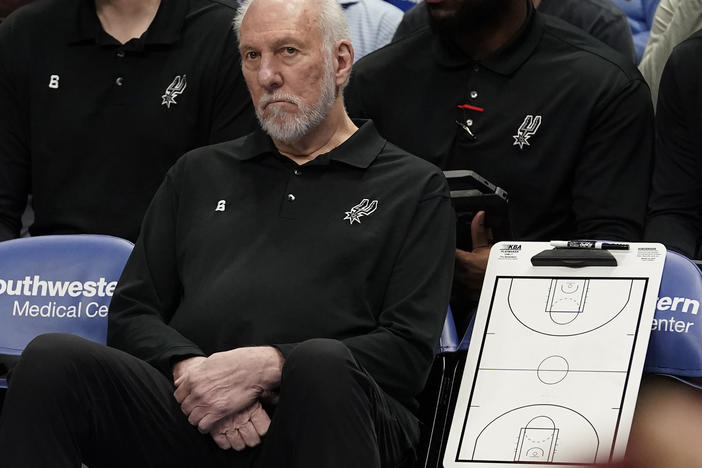 San Antonio Spurs beach coach Gregg Popovich sits on the bench during the first quarter of an NBA basketball game against the Dallas Mavericks in Dallas, Sunday, April 9, 2023.