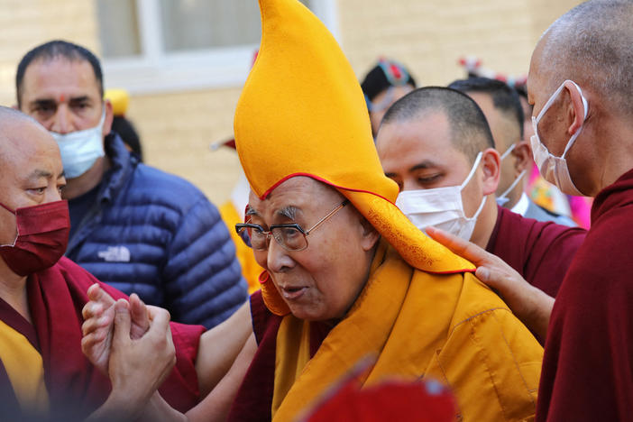 The Dalai Lama, pictured here at a prayer ceremony in McLeod Ganj last week, has come under fire for visibly kissing a young boy on the lips in a video that's been viewed millions of times.