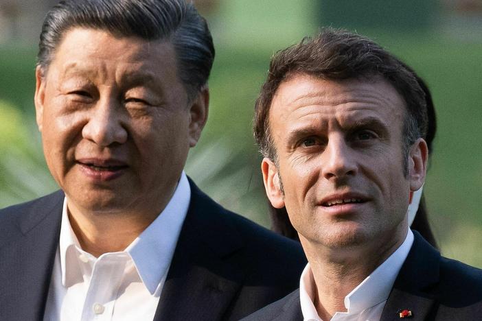 Chinese President Xi Jinping and French President Emmanuel Macron visit the garden of the residence of the Governor of Guangdong on April 7.
