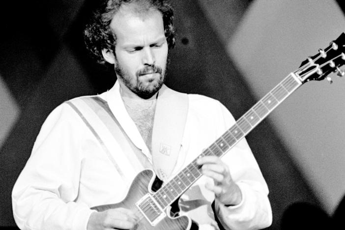 Lasse Wellander performs on stage with ABBA at the Wembley Arena in London in 1979.