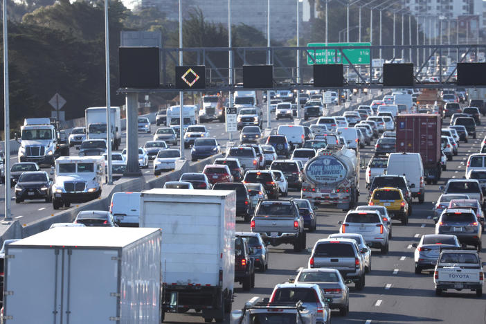 Traffic moves along Interstate 80 in Berkeley, Calif., on Feb. 16, 2022. The Biden administration proposed new tough emission rules so tough it would force auto makers to boost sales of electric cars to meet the requirements.